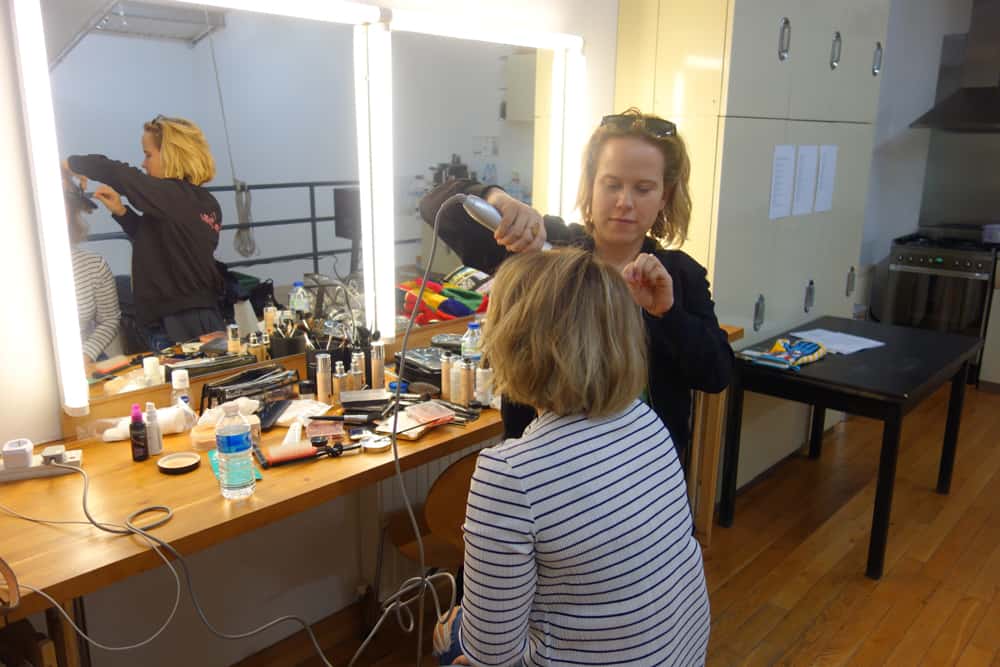 Hair dresser getting her make up done for JOB TODAY