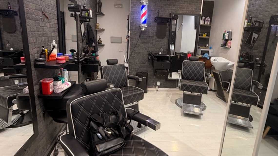 MAN'S CAVE BARBERSHOP cover image