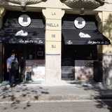 La paella de su logo