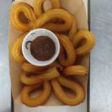 Churrería la parada logo